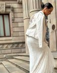A goregous Ivory Moto Vegan Leather Jacket worn over a Wedding Dress