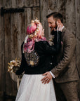 Celestial-themed Bridal Cover-Up in black leather, adorned with a romantic phrase for a timeless wedding ensemble