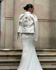 Bride wearing Ivory Leather Jacket over her Wedding Dress
