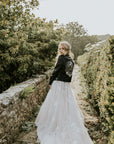 Celestial-themed bridal leather jacket with 'To The Moon & Back' inscription, ideal for a romantic wedding look