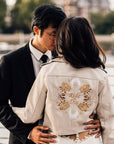 Custom ivory cropped bride leather jacket with zodiac embroidery – a stylish and personalized bridal cover-up for a unique and unforgettable wedding look
