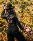 Skeleton couple-themed black bride leather jacket with The Lovers Tarot Card – a custom and edgy bridal cover-up for a wedding ensemble with a touch of the macabre