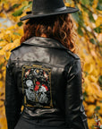 The Lovers Tarot Card black leather jacket for brides – a custom and mystical bridal cover-up featuring a skeleton couple, adding a unique and symbolic touch to your wedding look