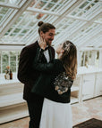 Chic leather wedding jacket featuring celestial elements and a heartfelt message – 'To The Moon & Back'