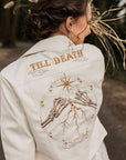 Ethereal Ivory Bridal Jacket: Enhance your wedding look with this 'Till Death' embroidered cover-up, featuring celestial accents in a beautiful ecru hue