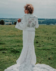 Wildflowers Bridal Cover Up: Elevate your wedding attire with this enchanting ecru embroidered jacket, adorned with delicate wildflowers for a touch of bohemian charm