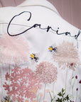 Wildflowers in Ecru: Enhance your wedding style with this charming embroidered jacket, a perfect blend of boho-chic and bridal sophistication