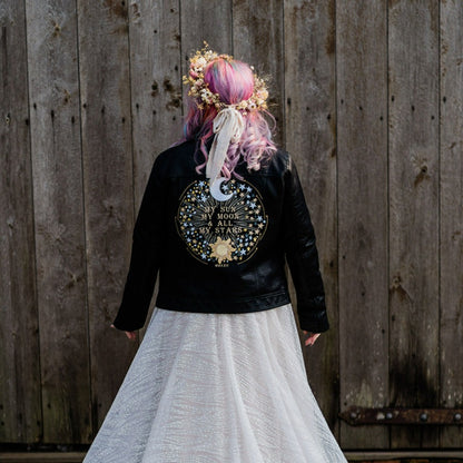 My Sun, My Moon & All My Stars Bridal Leather Jacket – a captivating black cover-up for a celestial-themed wedding
