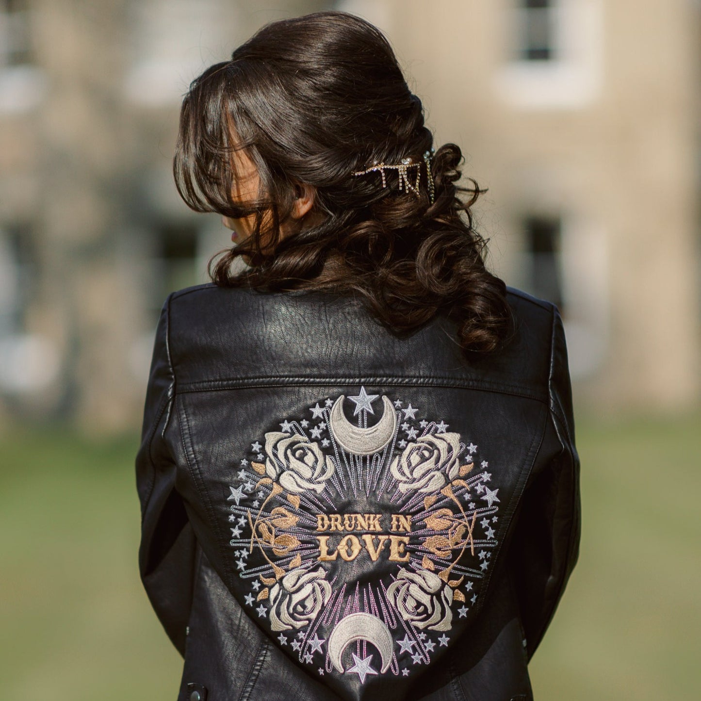 Drunk in Love Bridal Cover-Up – a fashionable black leather jacket for a modern and romantic wedding look