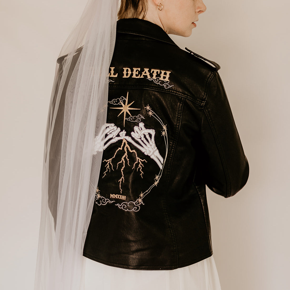 Till Death Bridal Leather Jacket featuring celestial symbols, a rebellious choice for the bride with a celestial spirit