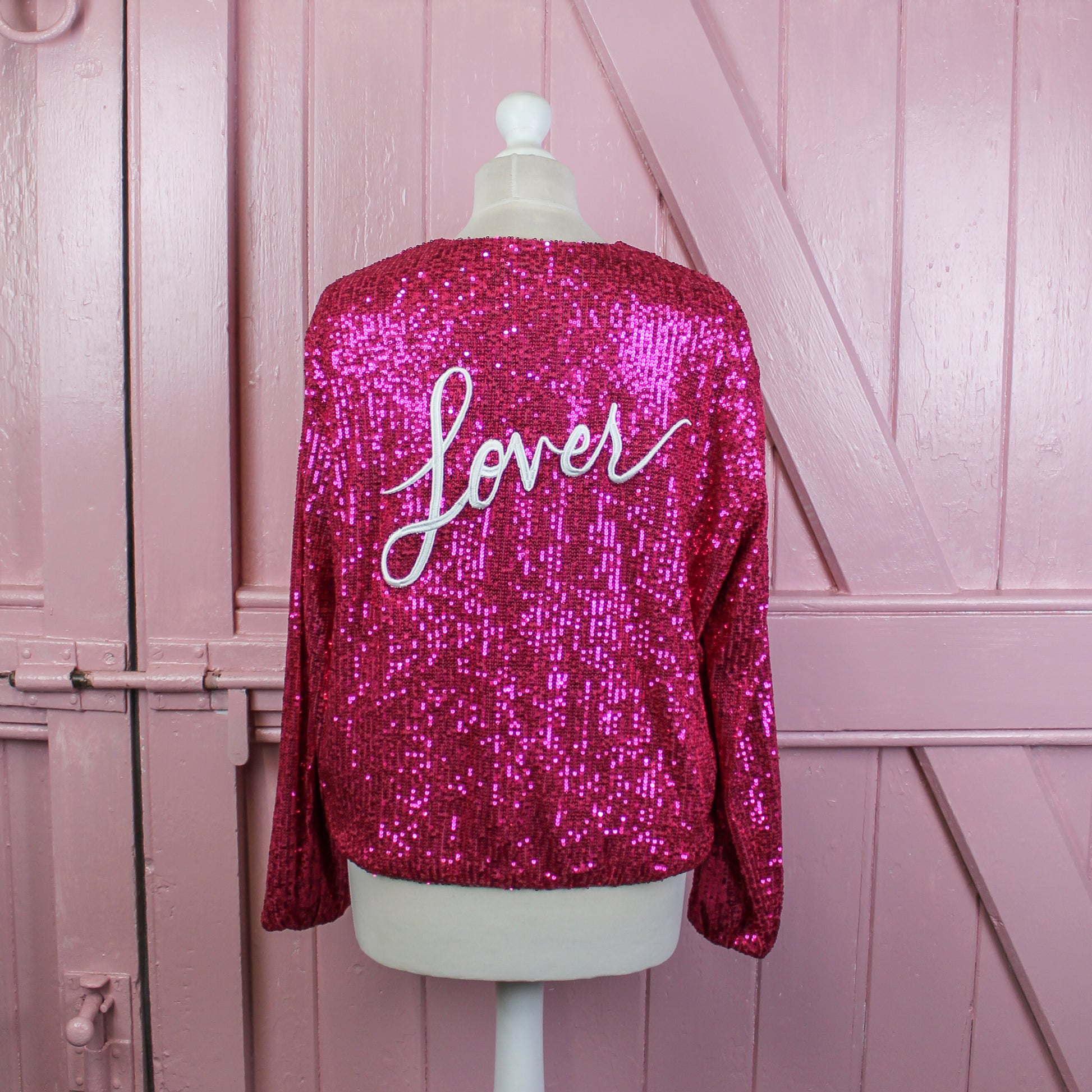 Make a statement with this glamorous sequin bomber jacket, ideal for brides seeking a unique and trendy bridal cover-up for their special day