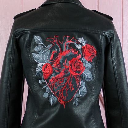 Gothic wedding bridal cover-up featuring a bride biker jacket with an embroidered anatomical heart - a bold and distinctive choice for your special day