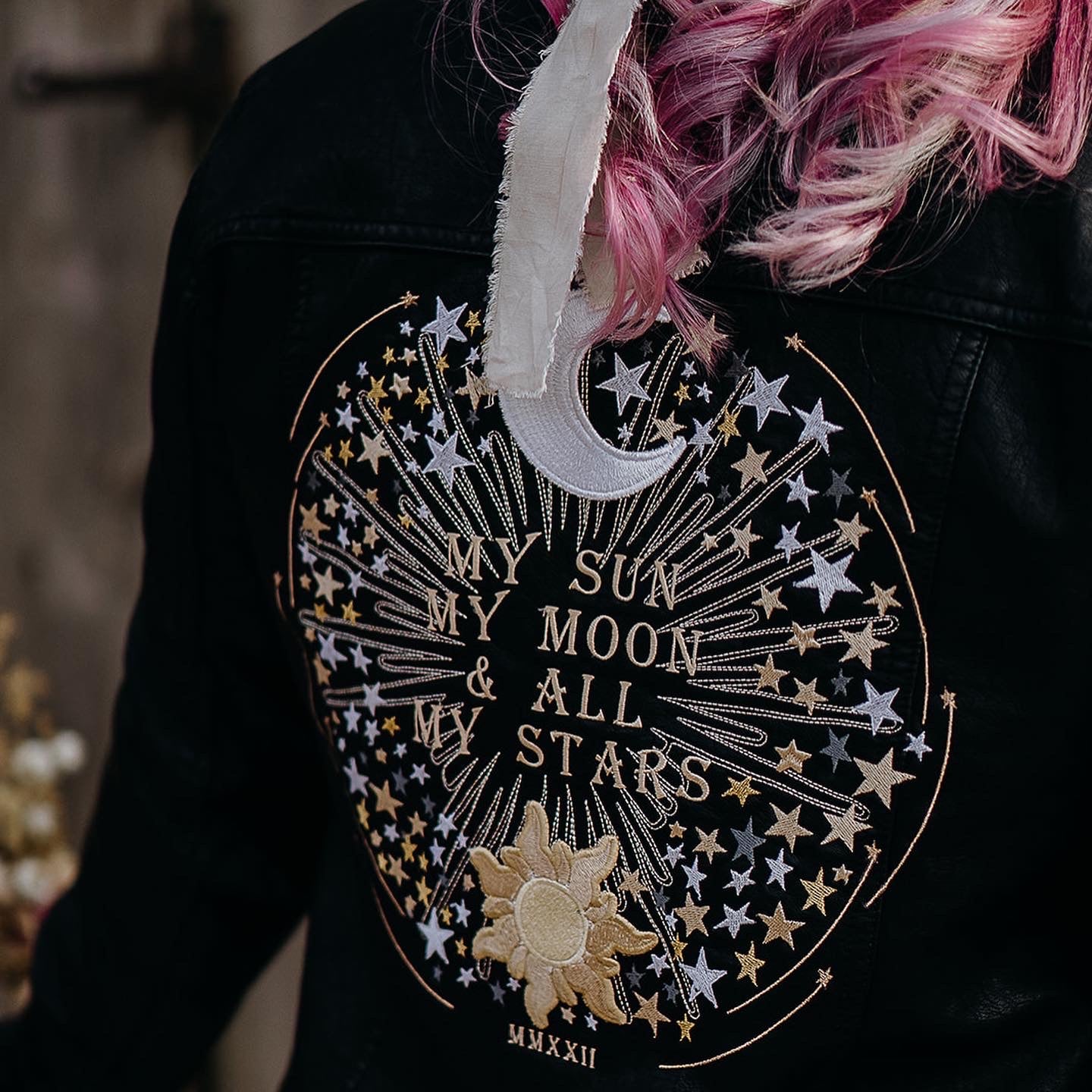 My Sun, My Moon & All My Stars Black Leather Jacket – a chic and symbolic accessory for a stylish bride