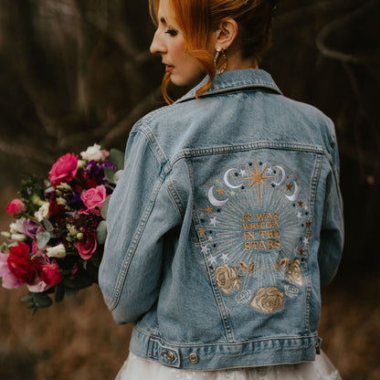 Written in the Stars Denim Bridal Cover Up: Add a celestial touch to your wedding attire with this ecru embroidered jacket, featuring a starry design that's truly written in the stars