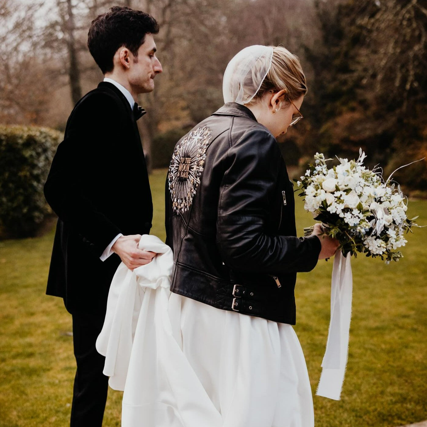 Black leather bridal jacket featuring 'To The Moon & Back' – a chic and enchanting cover-up for the modern celestial bride
