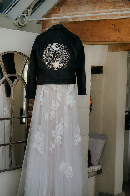 Bridal leather cover-up with celestial elements, perfect for the bride who wants to shine like the sun and the moon