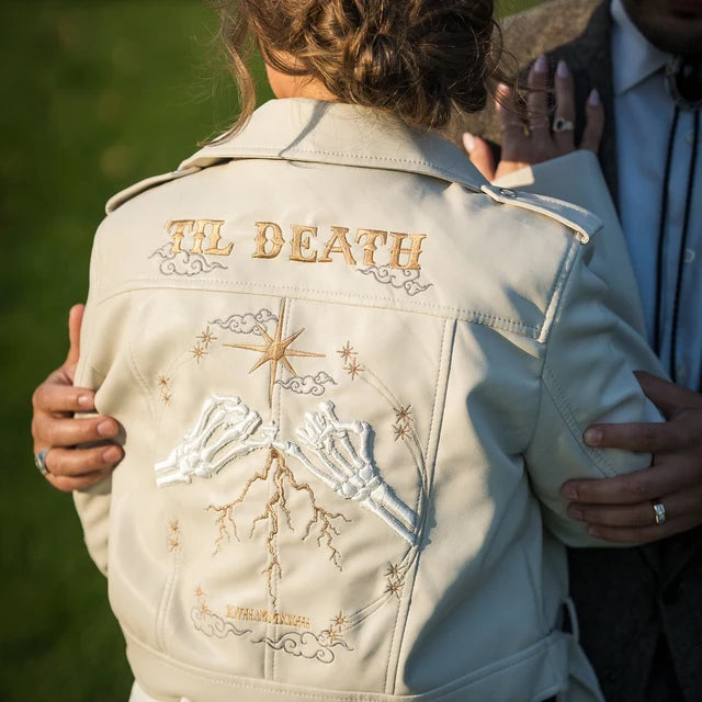 Custom ivory cropped bride leather jacket with zodiac embroidery – a unique and personalized cover-up for a trendy and modern wedding look