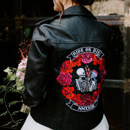 Ride Or Die Floral Skeleton Couple Bridal Cover-Up in black leather – a stylish and edgy addition to your wedding ensemble