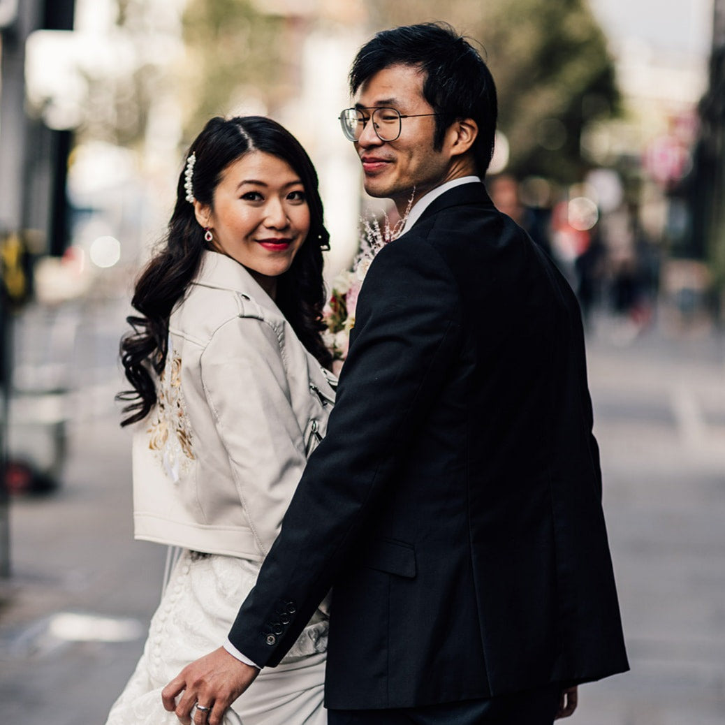 Zodiac-inspired embroidered ivory bridal jacket – a custom cover-up perfect for bridesmaids to gift the bride, adding a unique touch to her wedding ensemble