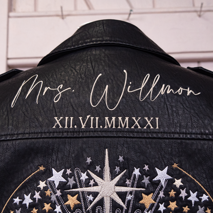 Black leather bridal jacket with celestial motifs and 'Mrs' for a chic and personalized wedding look