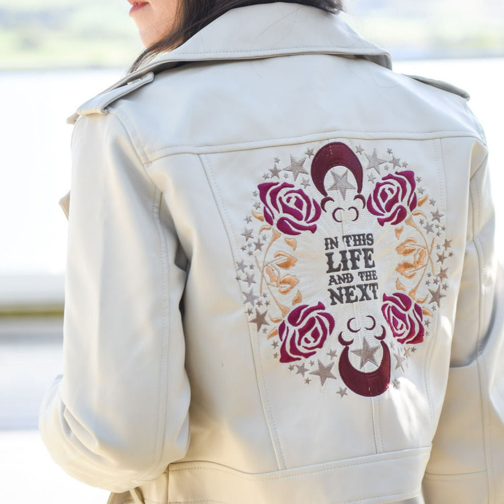 Bridal cover-up with zodiac embroidery, a personalized 'In this Life & the Next' gift from bridesmaids – a custom ivory leather jacket for a memorable wedding day