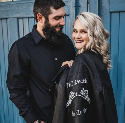 Black leather bridal jacket featuring a Skeleton Pinky Promise – Till Death Do Us Part, a chic and unconventional cover-up for the modern bride
