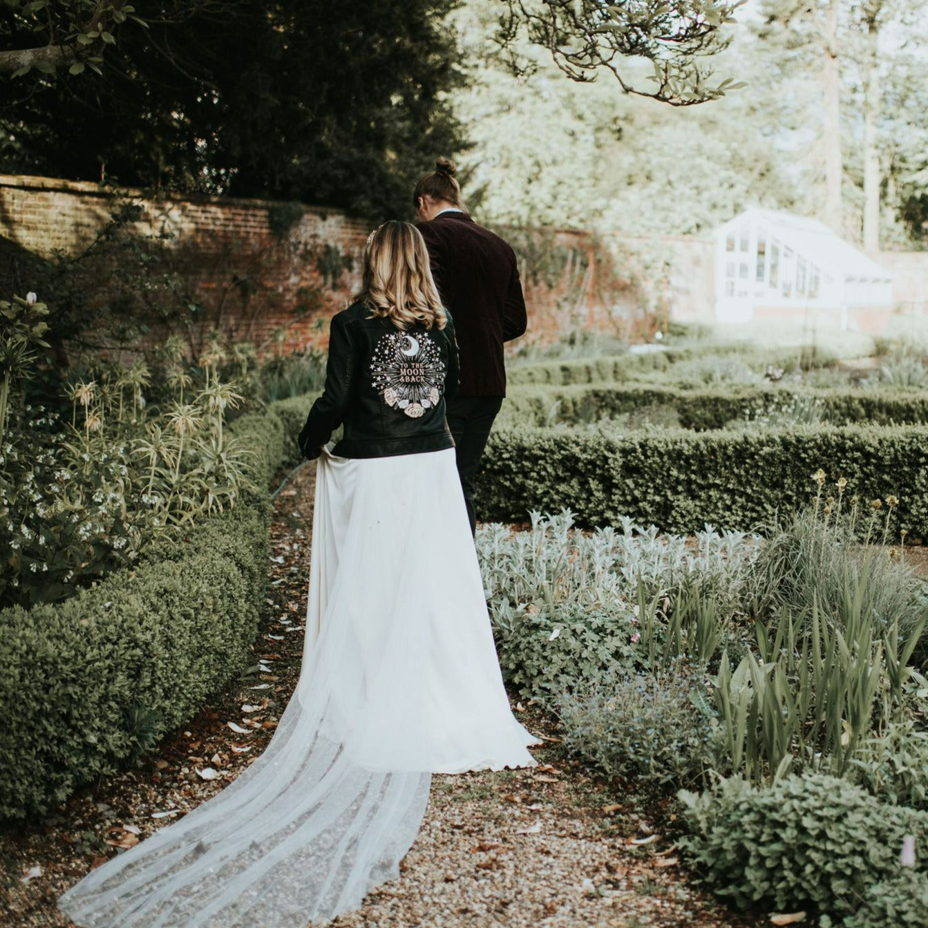 Celestial-themed bridal jacket with 'To The Moon & Back' inscription, perfect for a love-filled wedding