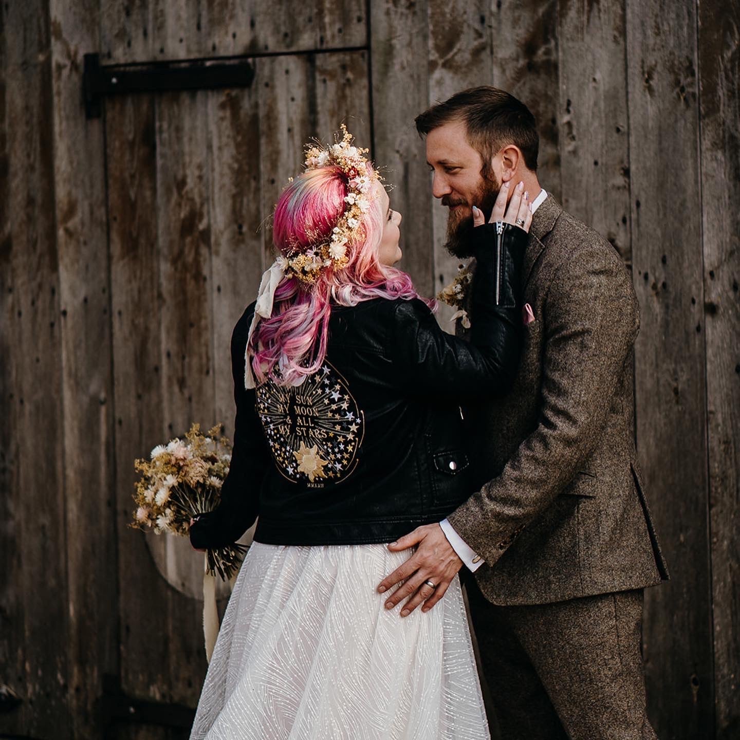 Celestial-themed Bridal Cover-Up in black leather, adorned with a romantic phrase for a timeless wedding ensemble