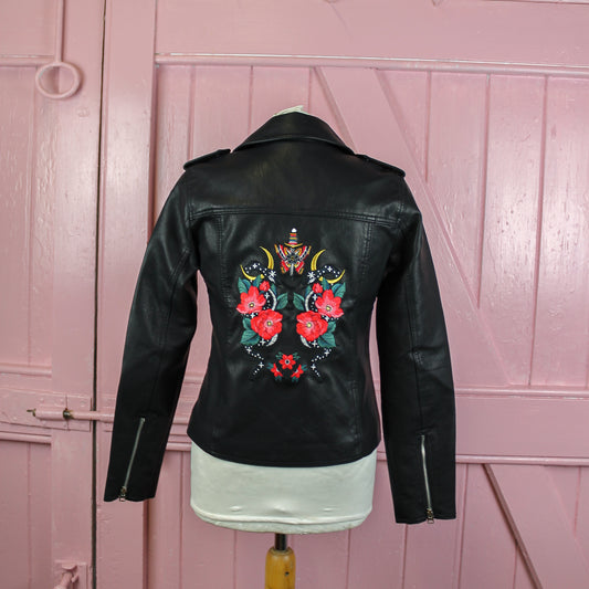 New Beginnings Black Leather Bridal Jacket – a symbol of fresh starts and stylish cover-up for a modern wedding