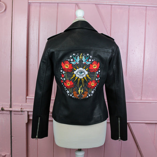 Custom black leather bridal jacket featuring intricate wedding embroidery for a unique and personalized touch