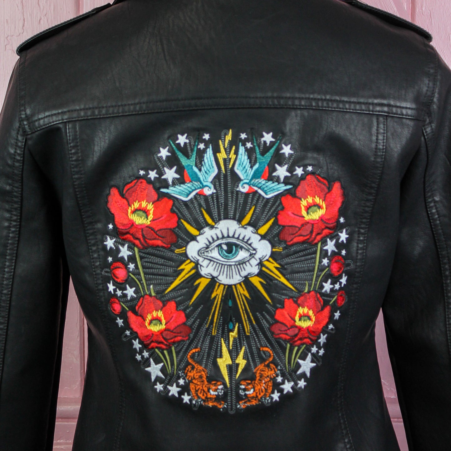 Gothic wedding leather jacket adorned with elegant embroidery, a stylish cover-up for the modern bride
