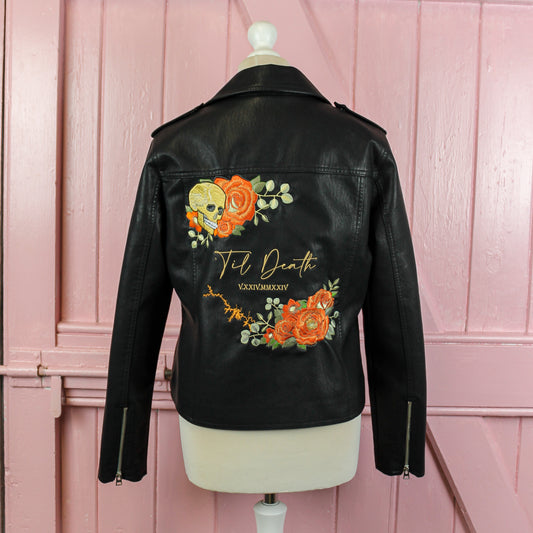 Custom black leather jacket for brides, adorned with elegant floral embroidery