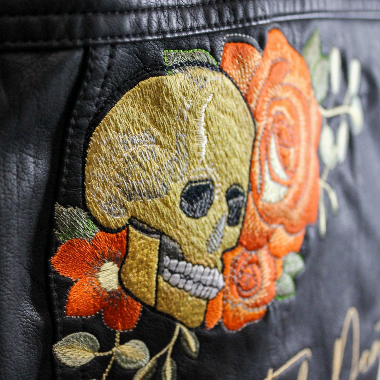 Bridal cover-up with a touch of gothic glam: custom embroidered leather jacket