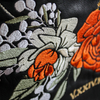 Floral embroidery on black leather jacket for bridal cover-up