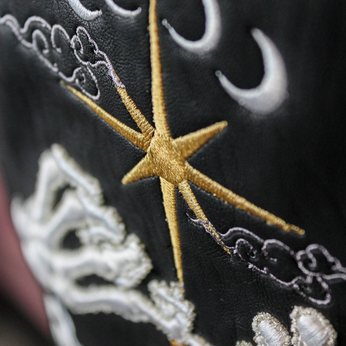 Black leather jacket adorned with moon and stars for weddings