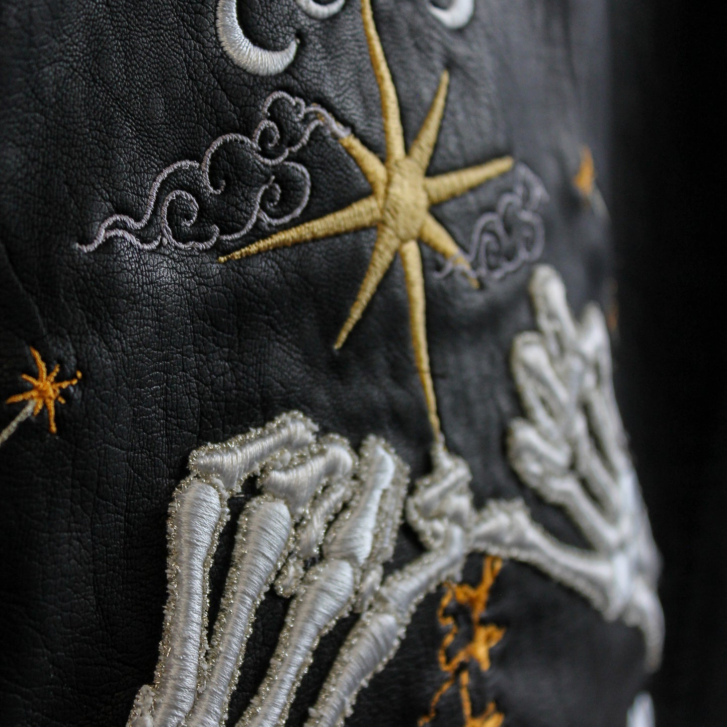 Celestial-themed black leather jacket for weddings