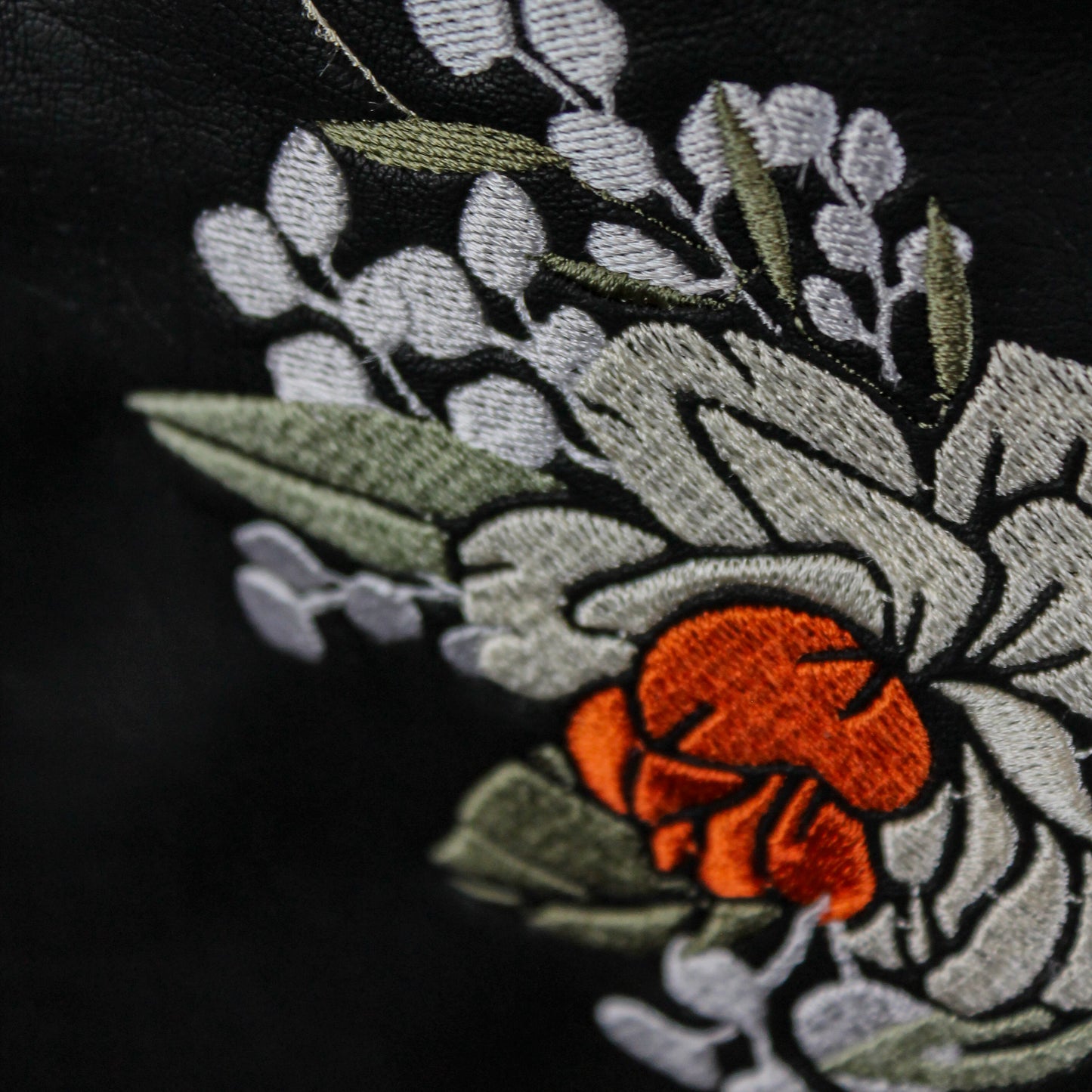 Floral wedding cover-up: Custom embroidered black leather jacket