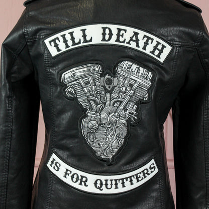 Black leather bridal jacket featuring a Motor Bike and Anatomical Heart – a chic and rebellious cover-up for the modern bride