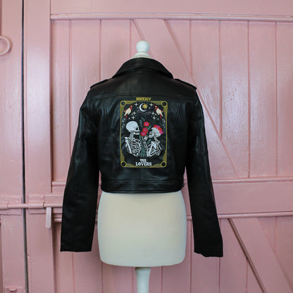 Custom bride leather jacket with The Lovers Tarot Card – a black bridal cover-up featuring a skeleton couple design, perfect for those looking to add a mystical and symbolic element to their wedding look