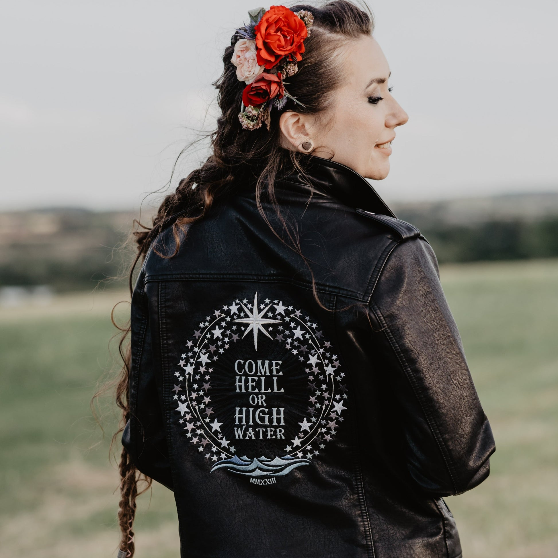 Chic and fearless Come Hell or High Water Black Leather Jacket – a perfect cover-up for a confident wedding celebration
