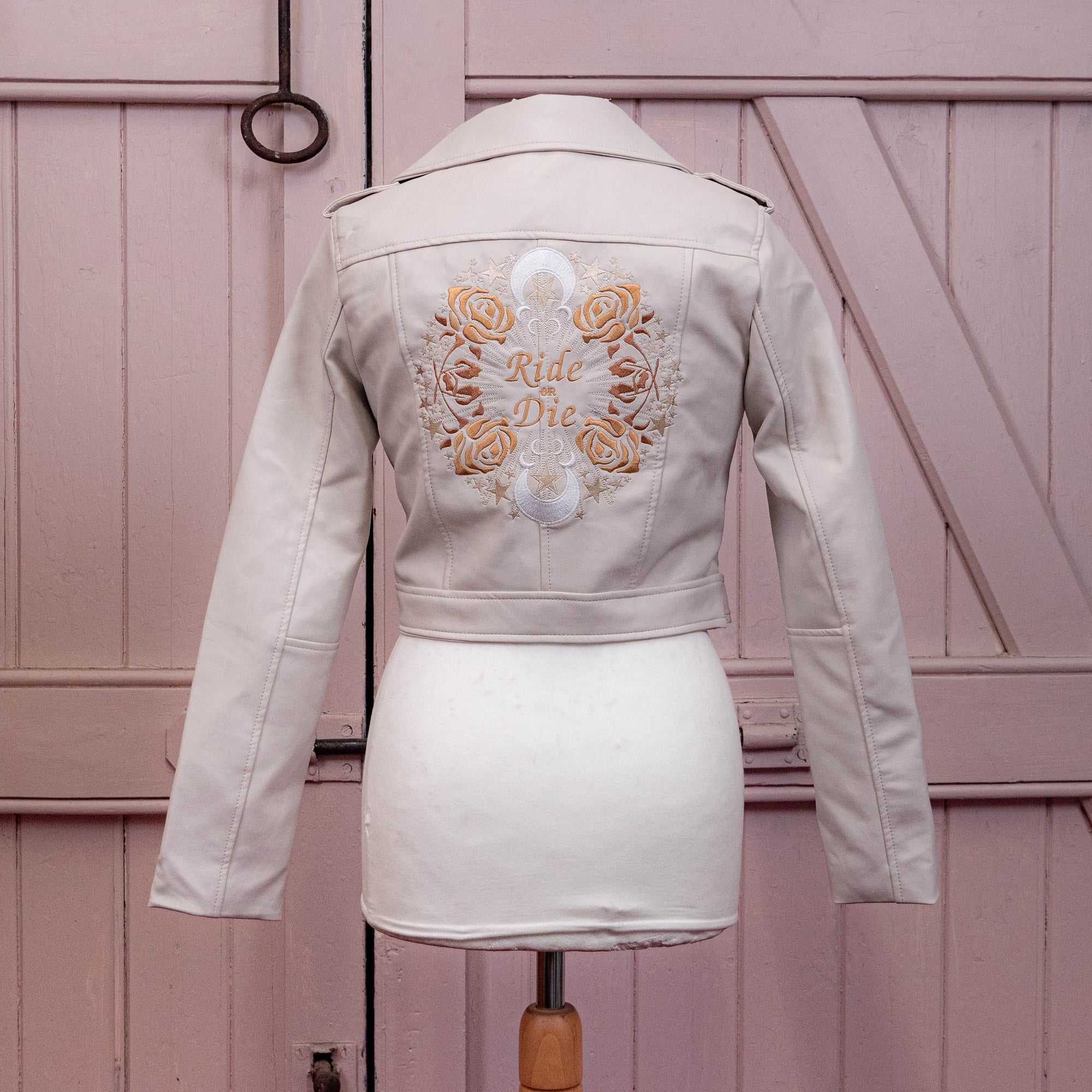 Bridal cover-up with zodiac embroidery, a thoughtful gift from bridesmaids to the bride – a custom ivory leather jacket for a memorable wedding day.