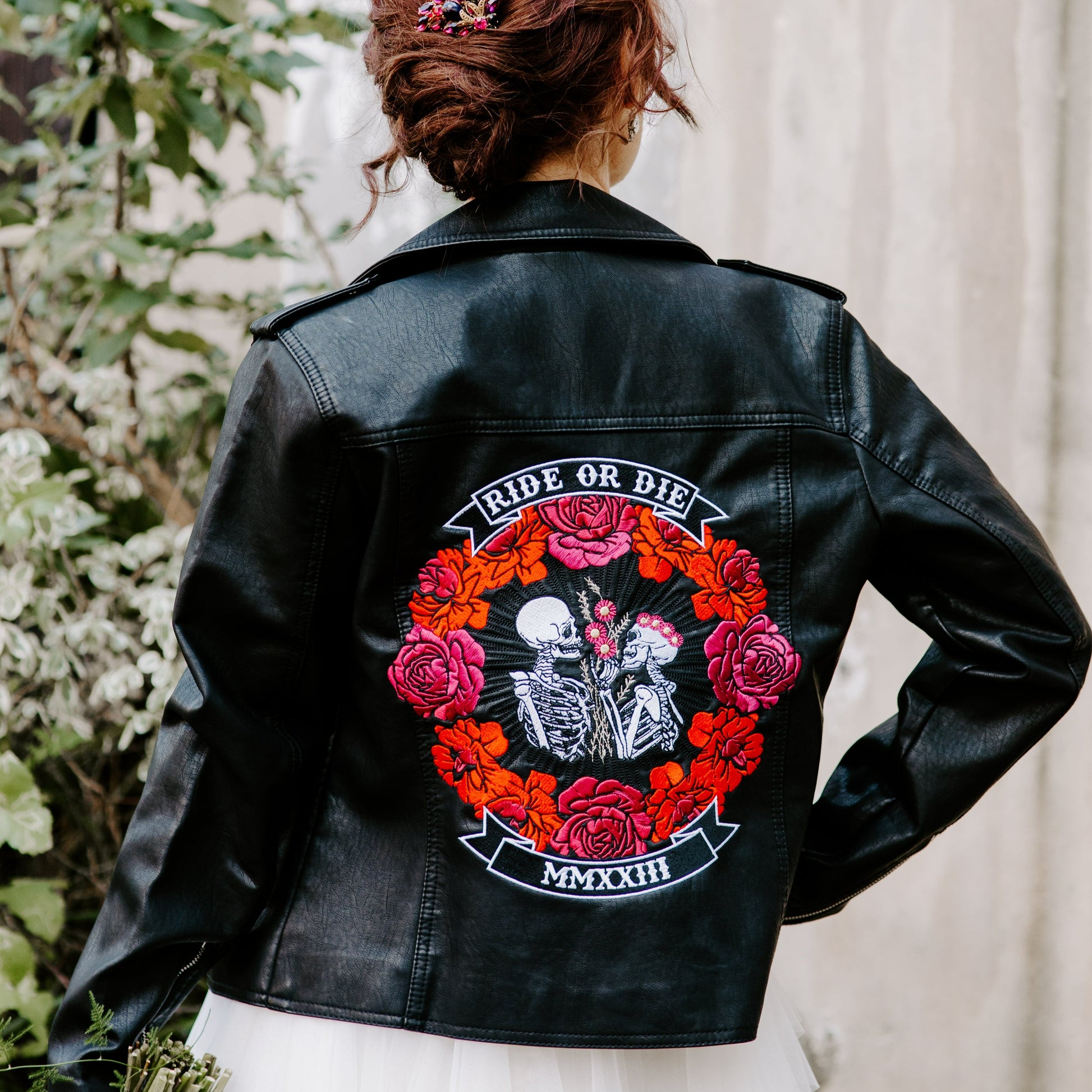 Ride Or Die Floral Skeleton Couple Black Leather Bridal Jacket – a bold and unique cover-up for a rebelliously romantic wedding look