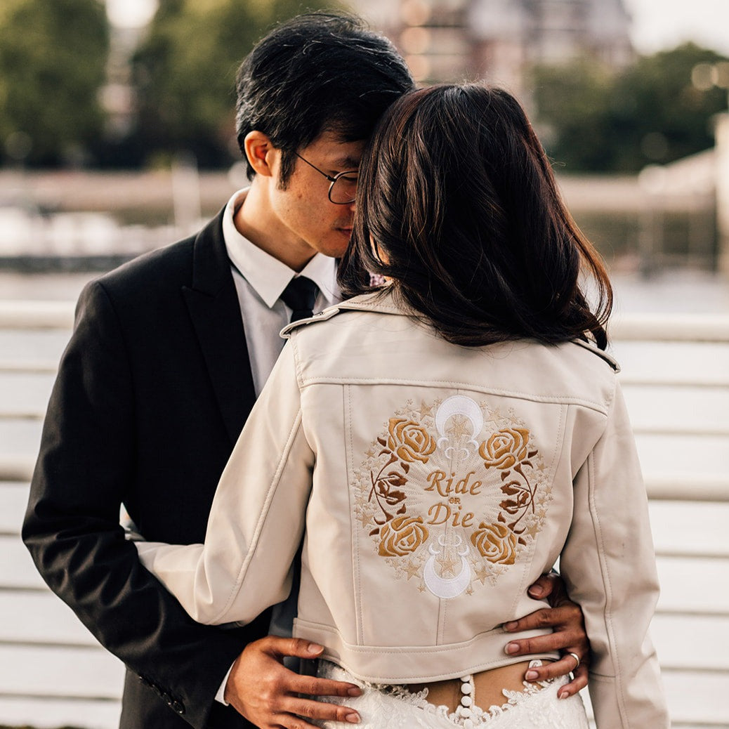 Custom ivory cropped bride leather jacket with zodiac embroidery – a stylish and personalized bridal cover-up for a unique and unforgettable wedding look