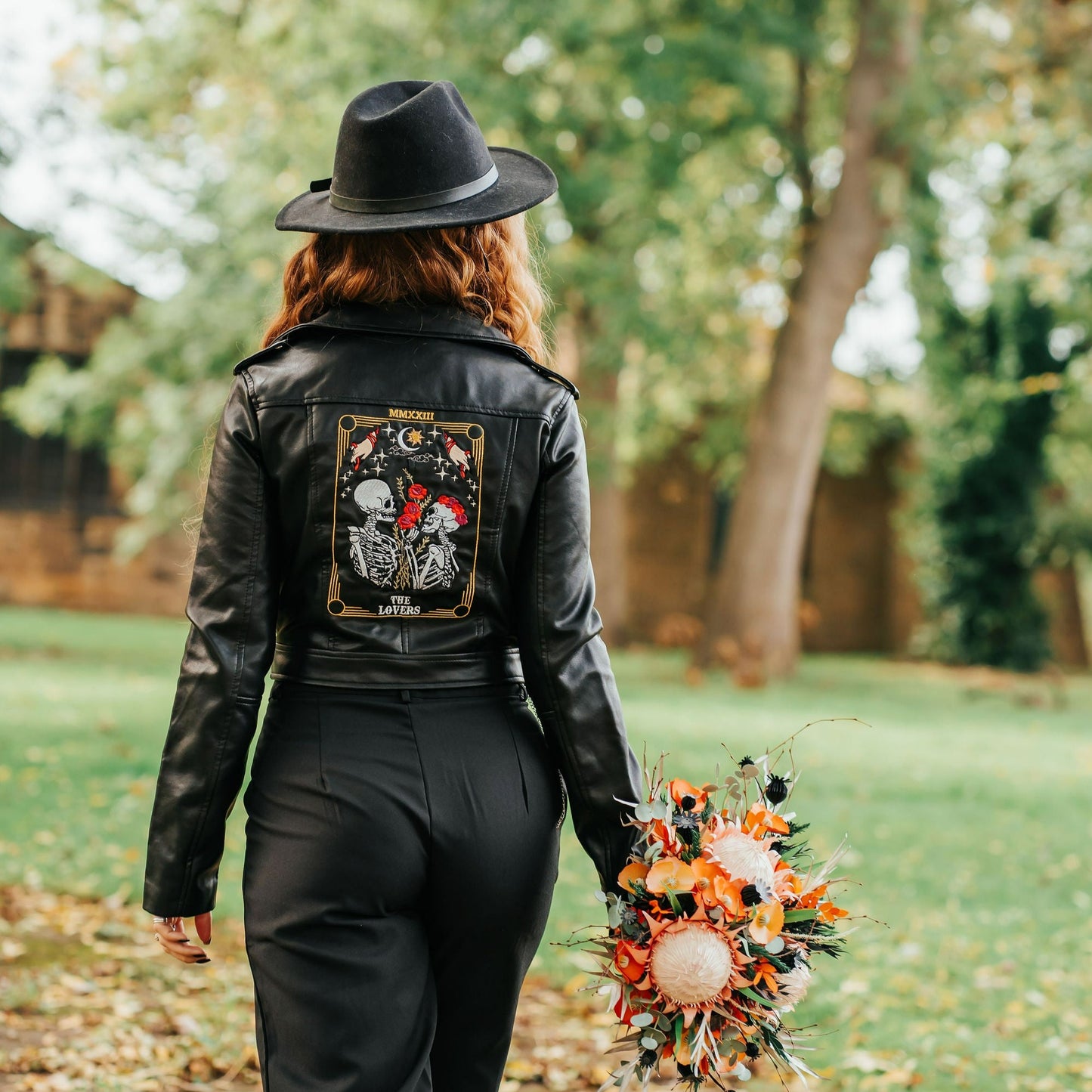 Black bride leather jacket featuring The Lovers Tarot Card – a unique and custom bridal cover-up for a wedding ensemble with mystical and symbolic flair