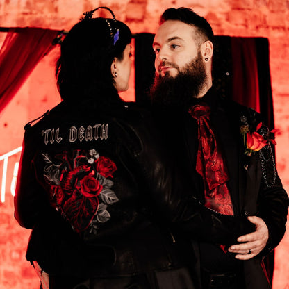 Stylish black leather jacket with intricate embroidery of an anatomical heart – perfect for a gothic or rock 'n' roll wedding bride