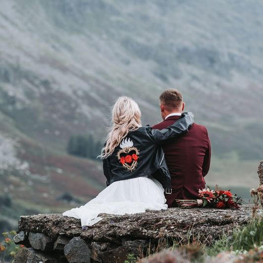 Custom women's black leather jacket with intricate embroidery – a stylish and personalized choice for a rock 'n' roll bride or a rockabilly-themed wedding ensemble