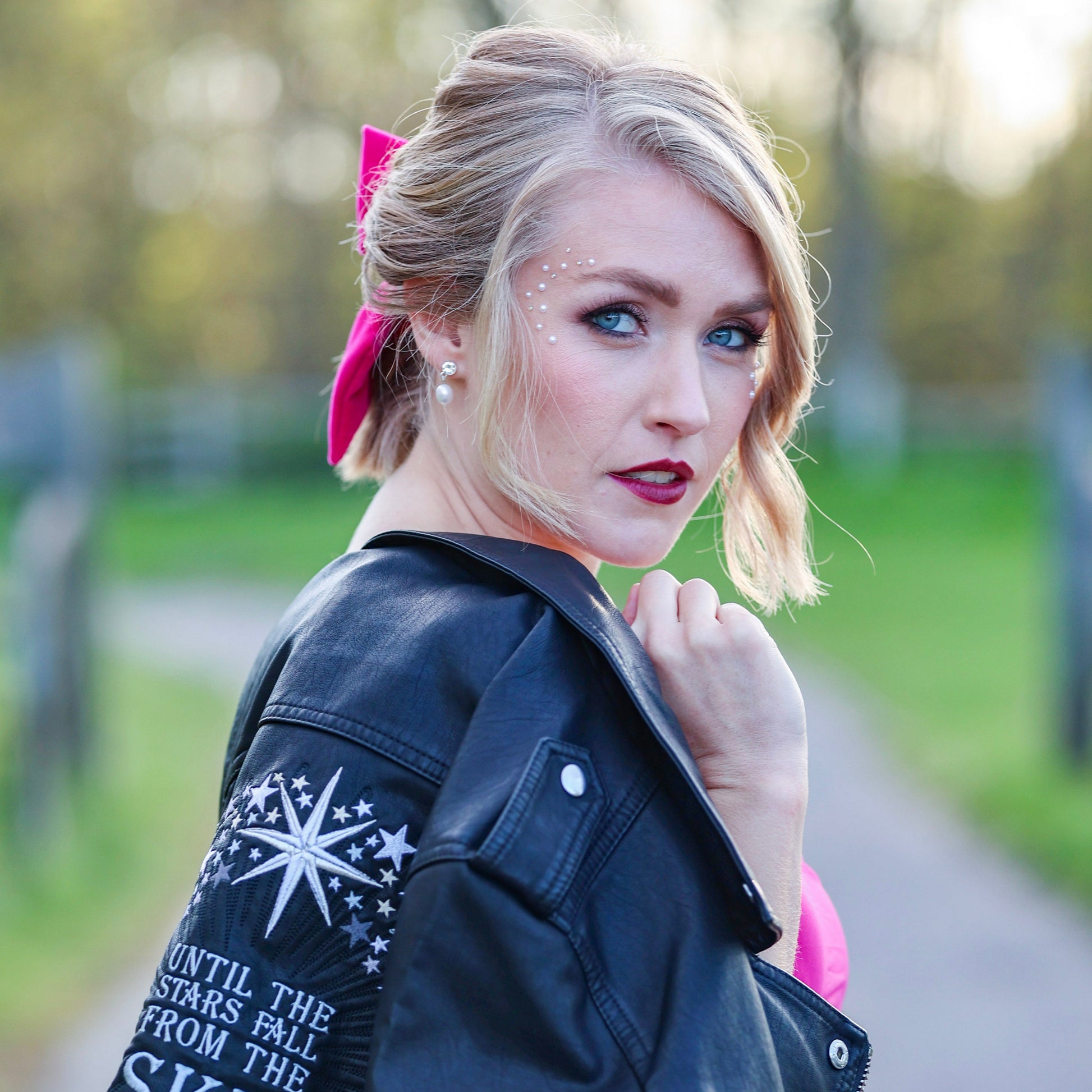 Bridal leather jacket with celestial motifs and a romantic message, perfect for a starlit wedding night
