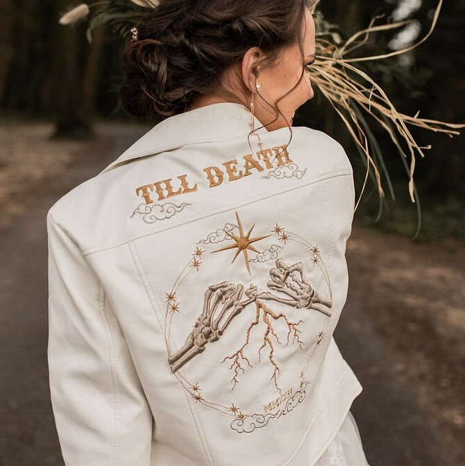 Ethereal Ivory Bridal Jacket: Enhance your wedding look with this 'Till Death' embroidered cover-up, featuring celestial accents in a beautiful ecru hue