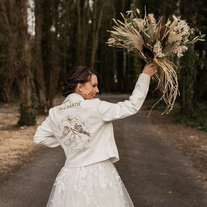 Celestial-Inspired Ivory Wedding Jacket: Elevate your bridal attire with this ethereal cover-up, adorned with celestial details and delicate ecru embroidery