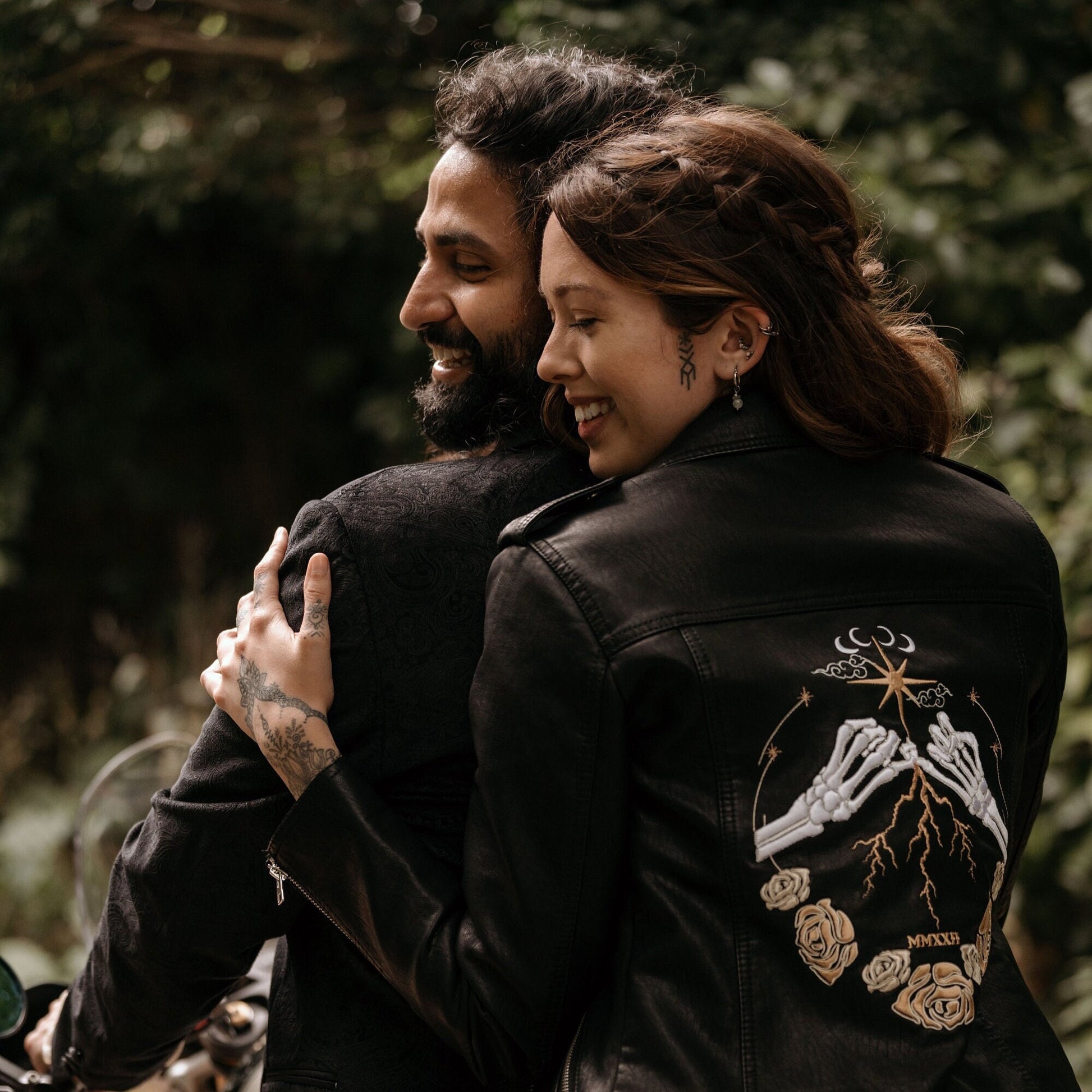 Bridal leather jacket in pink with intricate celestial designs, creating a unique and enchanting wedding outfit